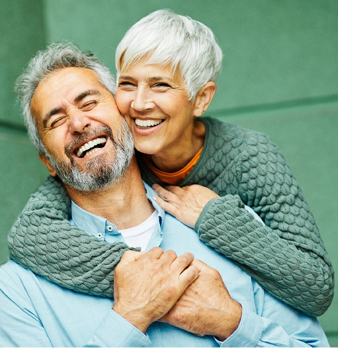Happy senior couple embracing each other