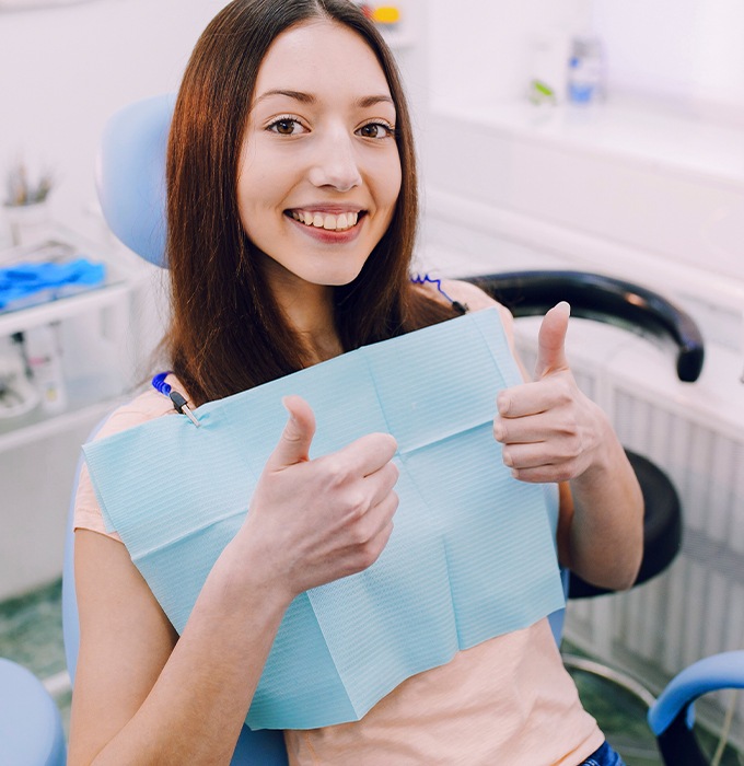 Woman in dental chair smiling