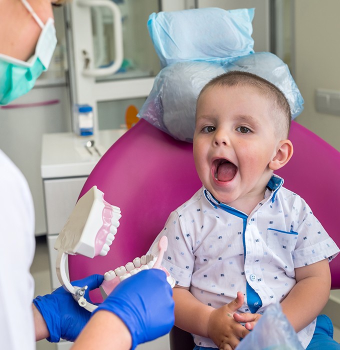 Little boy smiling during their first dental visit