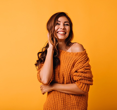 Confident, smiling woman with a tooth-colored filling in Barton City