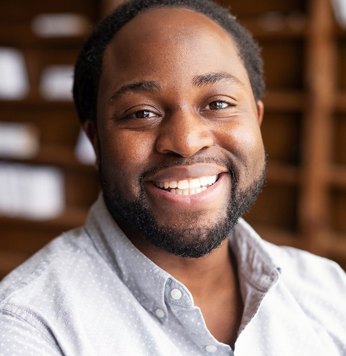 man smiling after getting dental implants in Barton City