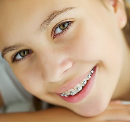 Teen girl with traditional braces