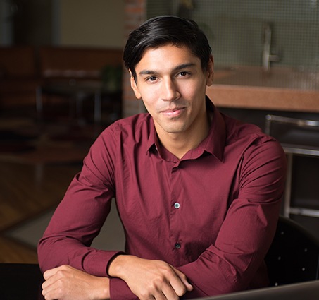 Young man smiling after periodontal therapy