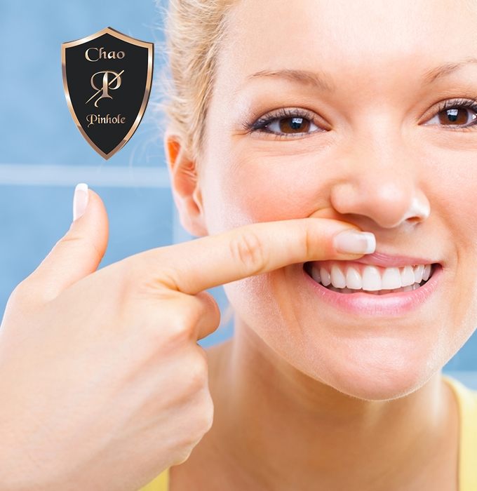 Woman looking at healthy smile after Chao Pinhole technique