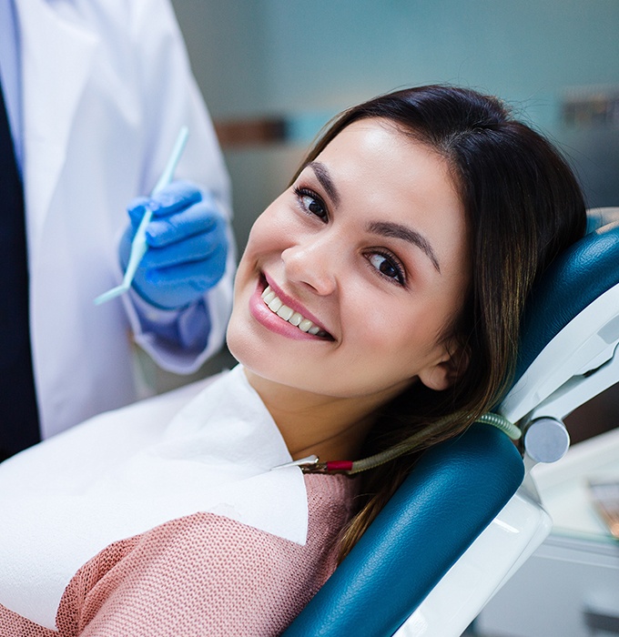 Woman smiling after dental checkup and teeth cleaning