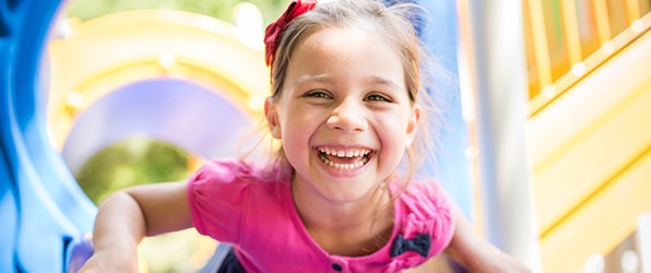 Young girl smiling after children's dentistry