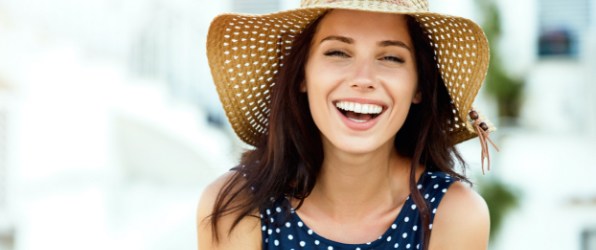 Woman with aligned smile after orthodontic treatment