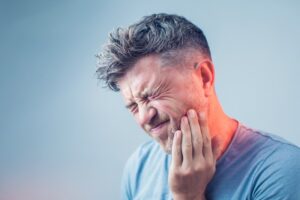 Man experiencing a toothache.